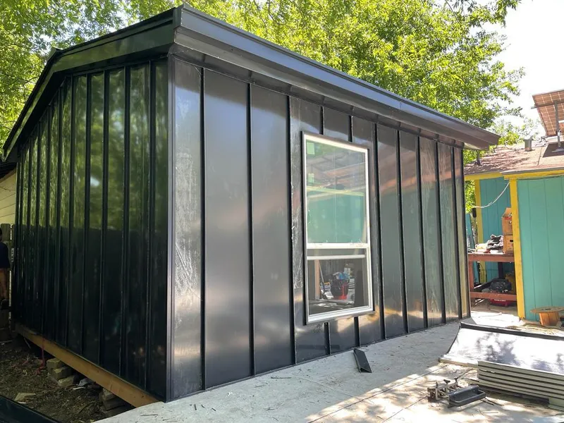 Black standing seam metal wall panels for Roof Inspection in Boerne