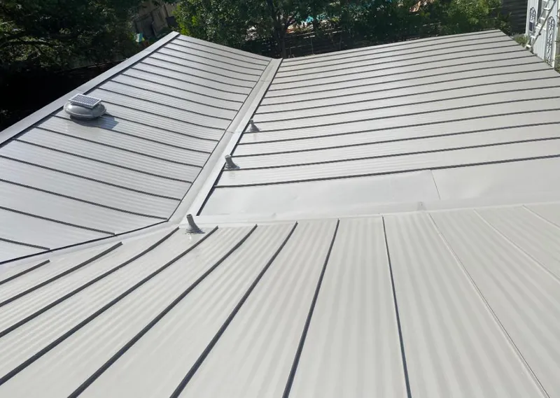 Solar attic fan installed on a metal roof for Roof Ventilation in Boerne