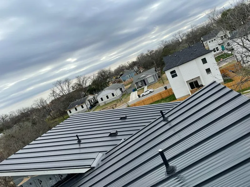 Standing seam metal roof panels with vents for Skylight Repair in Boerne